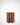 Wooden wine rack with multiple bottles on a white background