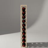 Wooden wine rack with six bottles of red wine on a gray background