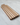 Wooden cutting board with striped pattern on a marble surface