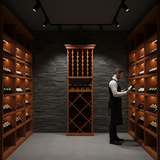 Person in a wine cellar inspecting bottles among wooden shelves.
