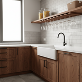 Modern kitchen with wooden cabinets, white countertop, and glass shelves.