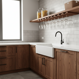 Modern kitchen with wooden cabinets, white countertop, and glass shelves.