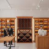 Wine cellar with wooden shelves and a reception desk.