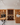 Wine cellar with wooden shelves and a reception desk.
