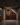 Wine cellar with wooden wine rack against a stone wall