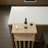 Wooden wine rack with bottles and glasses on a kitchen island.