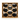 Wooden wall art with honeycomb design and black balls on a white background