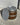 Wooden barrel with metal cap on a concrete surface