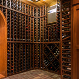 Wine cellar with wooden racks filled with wine bottles.