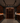 Man in a wine cellar examining bottles