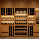 Wooden wine cellar with shelves filled with wine bottles