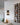 Wine bottles arranged on a wall-mounted rack in a modern interior setting.