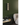 W Series 2 Foot Tall Rack in Matte Black Storing 12 Bottles in a room