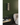 W Series 2 Foot Tall Rack in Matte Black Storing 18 Bottles in a room