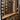 Wine rack with bottles on a wooden shelf in a modern interior setting.