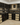 Wine cellar with shelves filled with wine bottles and wooden crates.