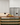 Wooden wine rack with bottles in a modern kitchen setting