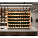 Wooden wine rack with bottles on a modern kitchen counter.