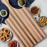 Lifestyle Image of Long Handle Charcuterie and Cutting Board with Food