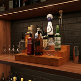 Bottles on a wooden shelf with a brick wall background