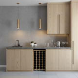 Modern kitchen with wooden cabinets, gray countertop, and wine rack.