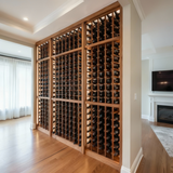 Wooden wine rack filled with bottles in a room with a fireplace and television.