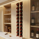 Wine rack in a wooden cabinet with wine bottles and glasses.